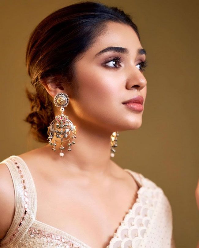 Krithi Shetty Staggering Poses In White Saree